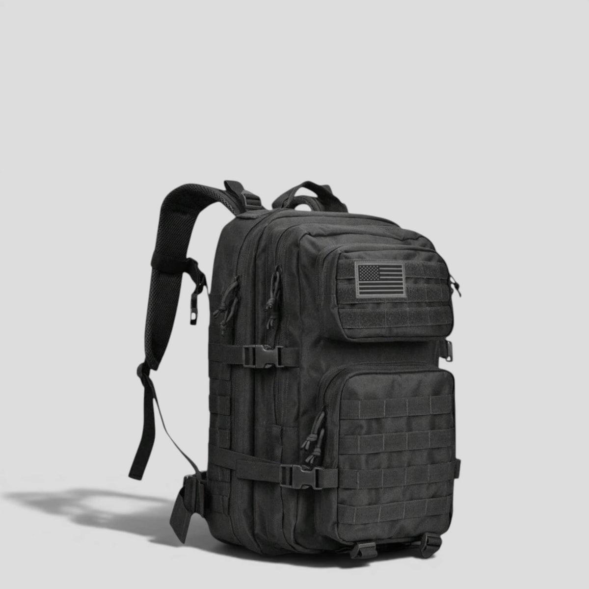 Side view of black tactical military backpack showing padded shoulder straps, MOLLE webbing, and structured upright body