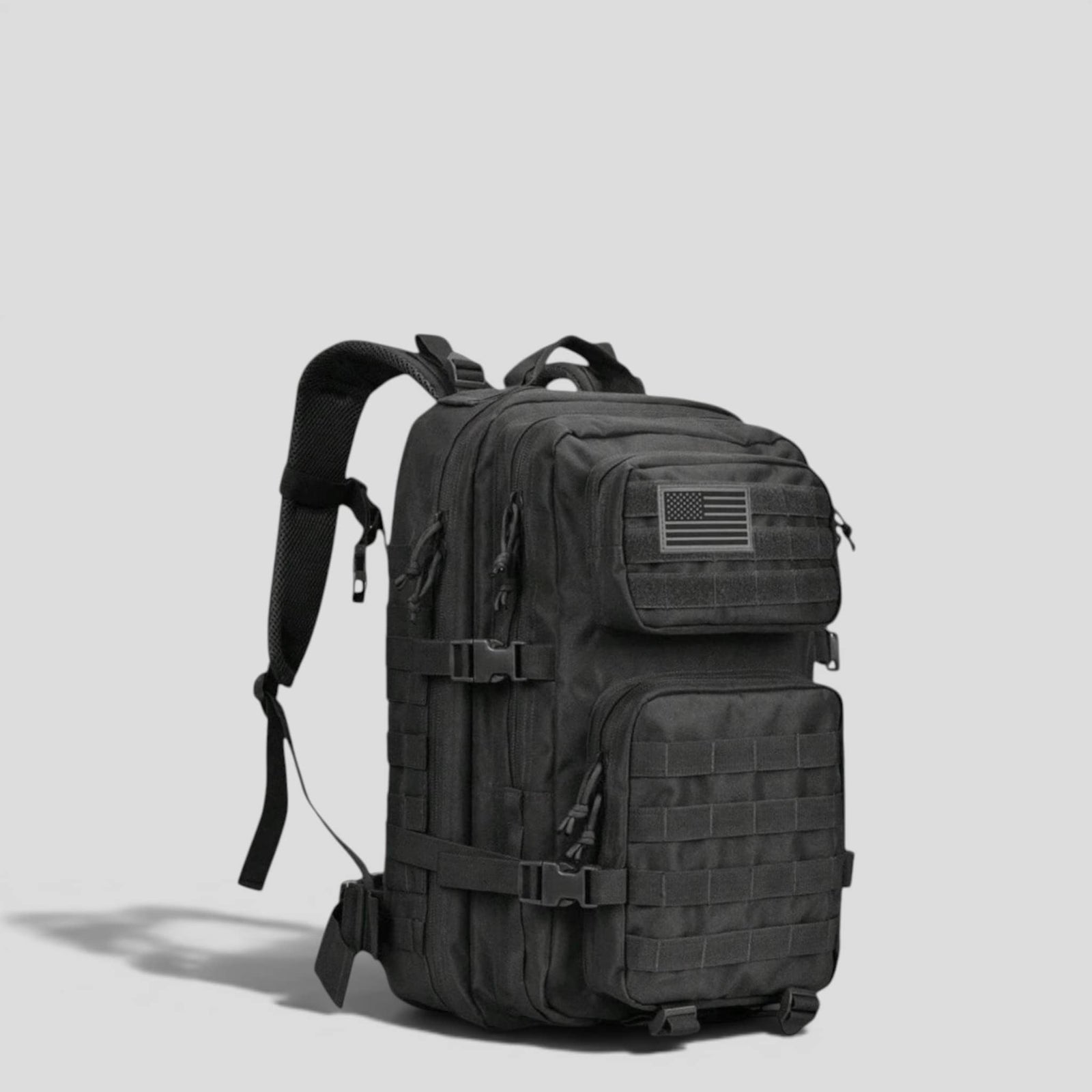 Side view of black tactical military backpack showing padded shoulder straps, MOLLE webbing, and structured upright body