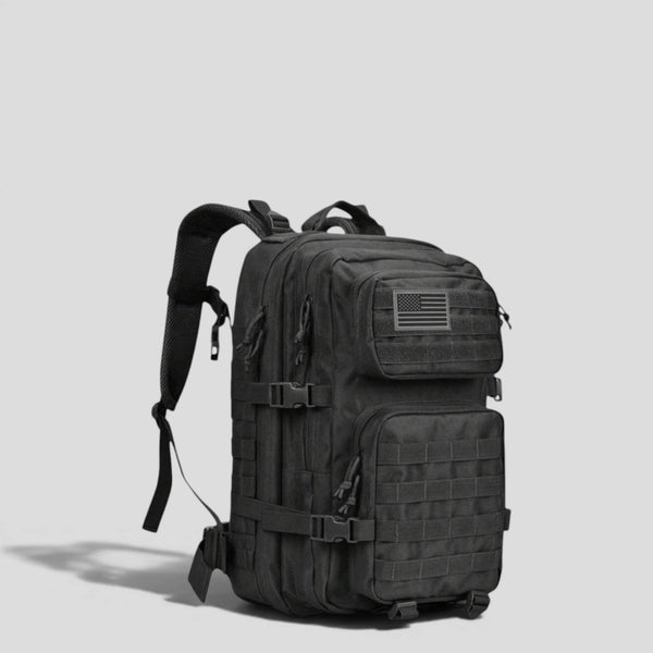 Side view of black tactical military backpack showing padded shoulder straps, MOLLE webbing, and structured upright body