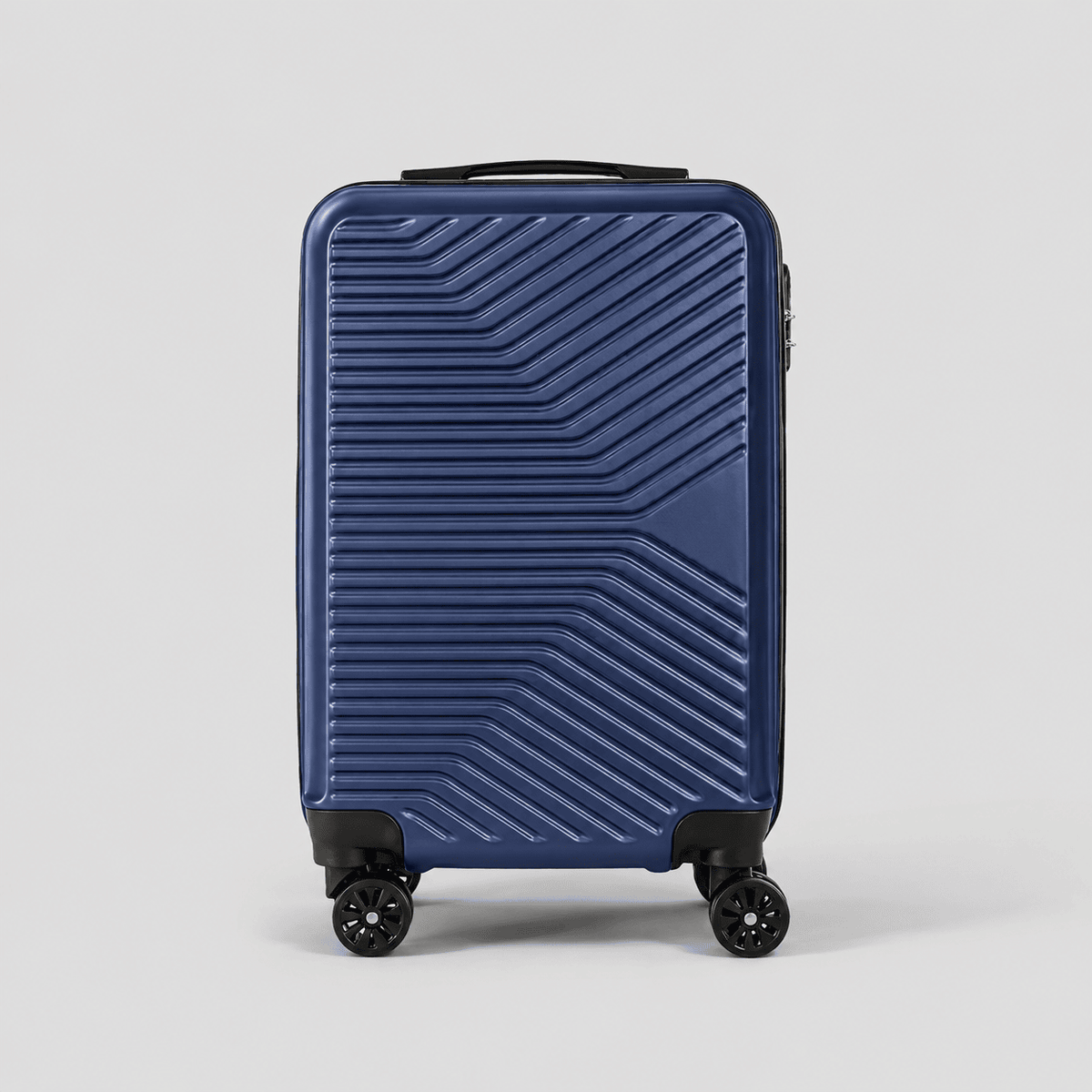 Front view of navy blue large carry on suitcase showing full chevron rib pattern, perimeter zipper, and dual spinner wheels
