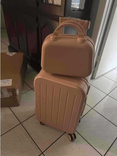 roamio atlas stacked on a tiled floor with a cardboard box in the background.