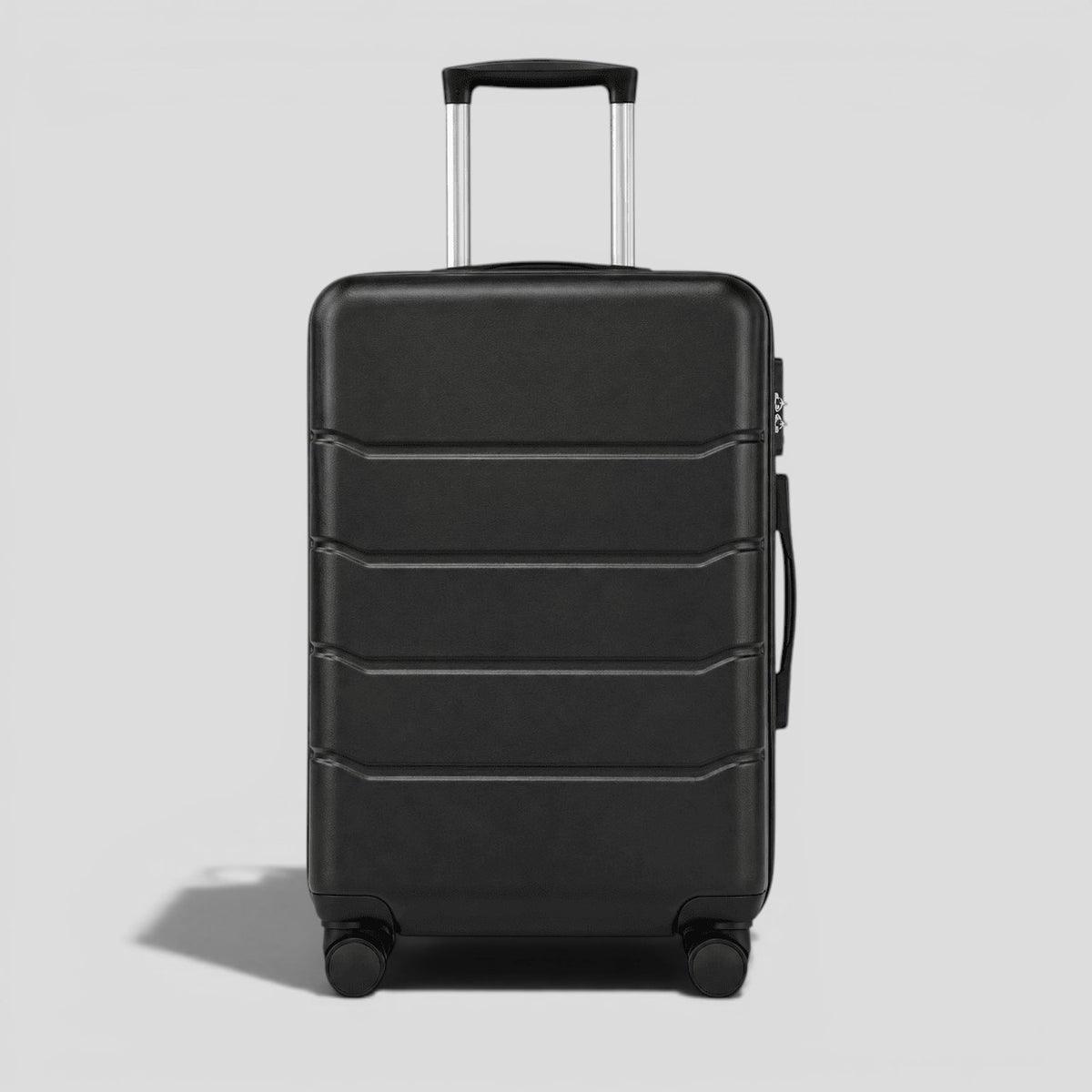 Black onyx hardshell large suitcase with horizontal ribbed exterior, extended telescoping handle, and four 360 degree spinner wheels
