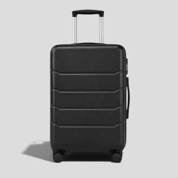 Black onyx hardshell large suitcase with horizontal ribbed exterior, extended telescoping handle, and four 360 degree spinner wheels
