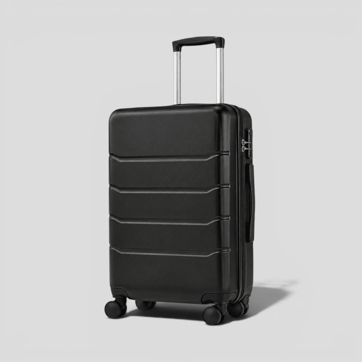 Side view of black matte hardshell carry on luggage showing perimeter zipper, side carry handle, and spinner wheel base
