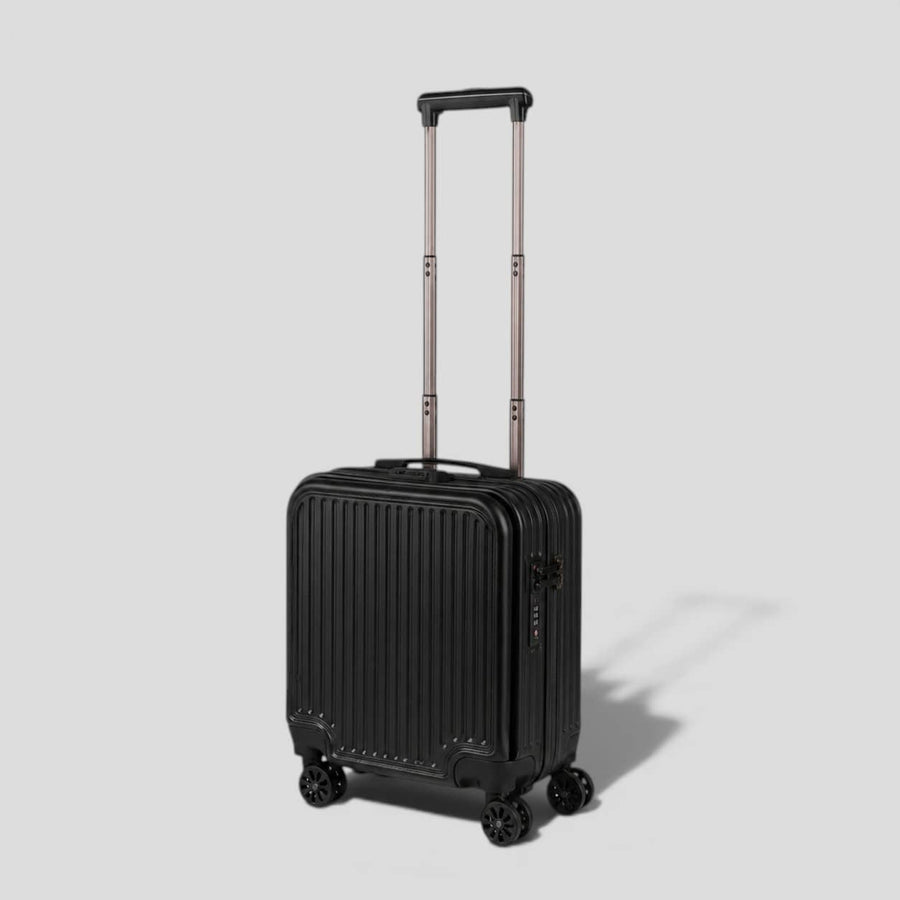 Black onyx hardshell small carry on luggage with extended telescoping handle, ribbed exterior, 360 spinner wheels, and front zip pocket
