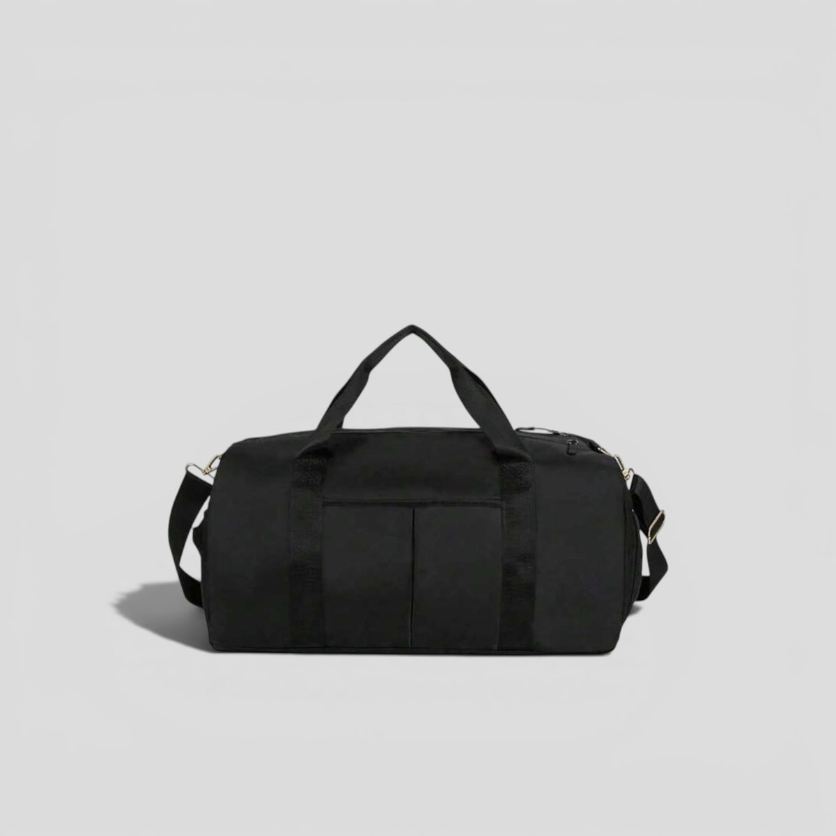 Black canvas tactical duffel bag with top carry handles, front utility pockets, and adjustable shoulder strap with silver hardware