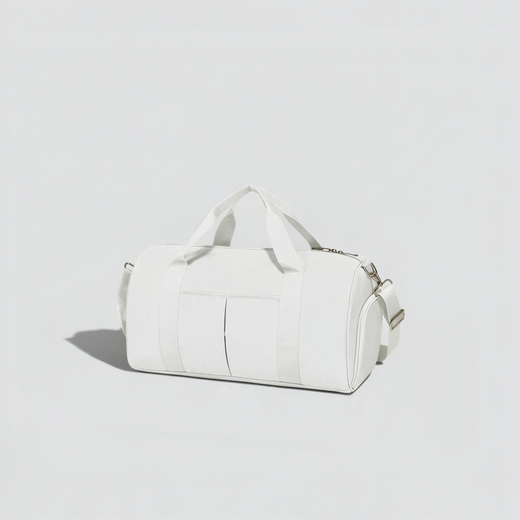 White canvas tactical duffel bag with top carry handles, front utility pockets, and adjustable shoulder strap with silver hardware